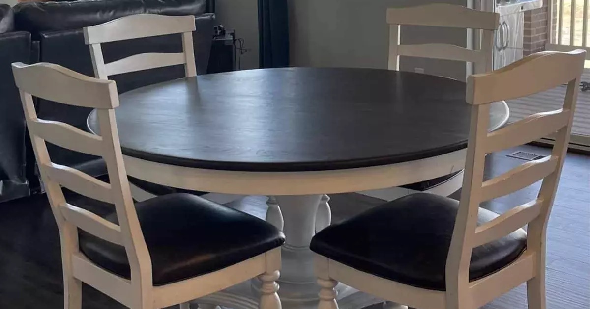 round black wood table with four chairs