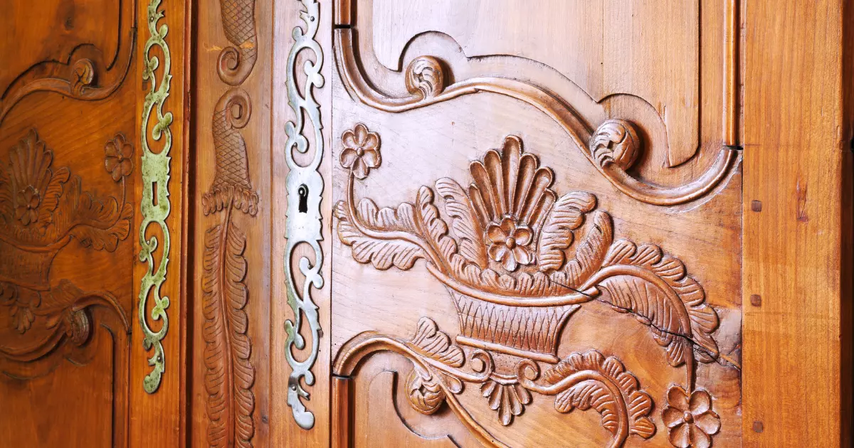 Decorative wood door panel showcasing handcrafted cabinets