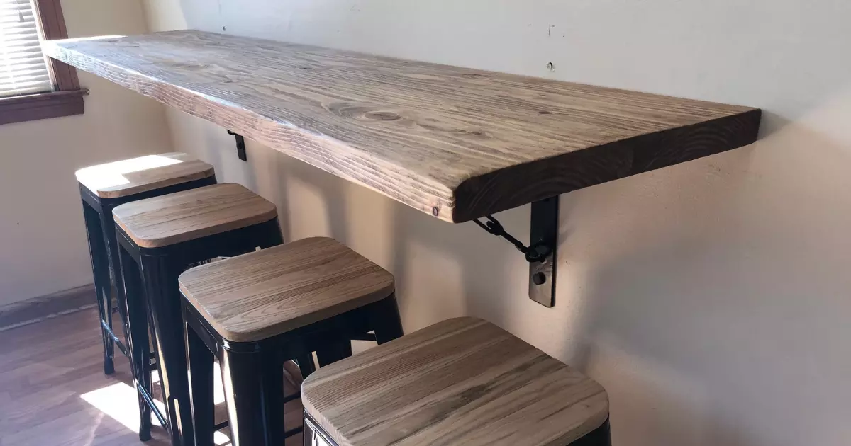 Rustic wood space saving wall table paired with bar stools designed for small dining areas and cozy apartments