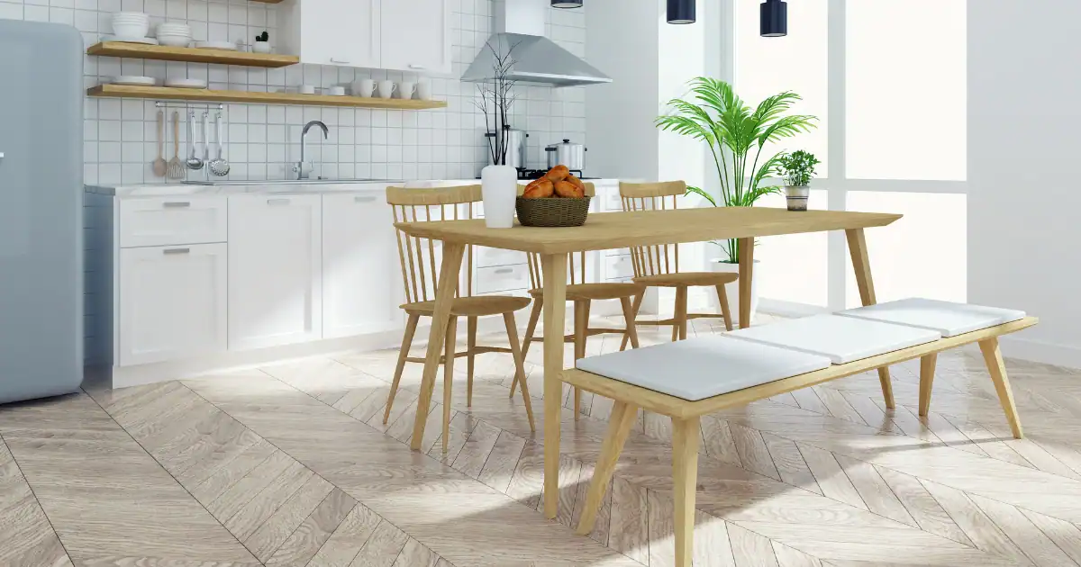 Bright kitchen dining area styled with handcrafted wood chairs and a matching wood bench