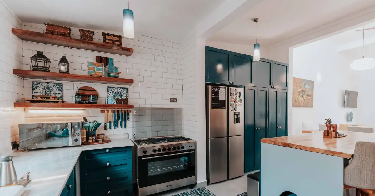 Modern kitchen with floating wood shelves and dark cabinetry showcasing open shelving vs. closed cabinets for stylish storage