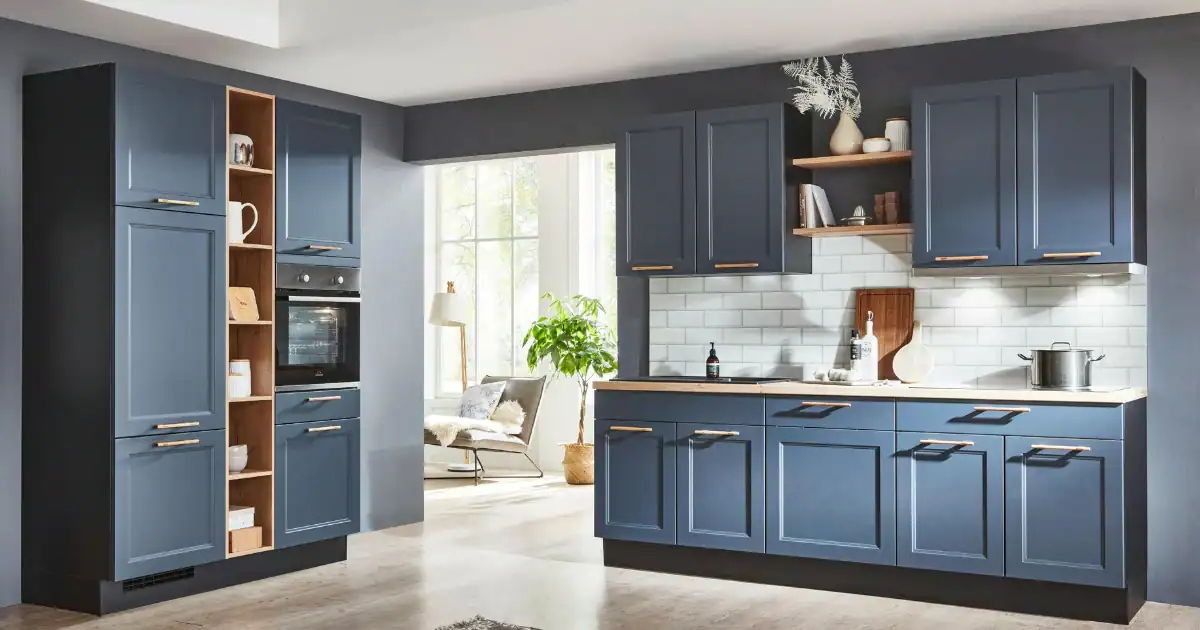 Modern kitchen with dark blue cabinets and built in closet shelving for stylish storage and organization